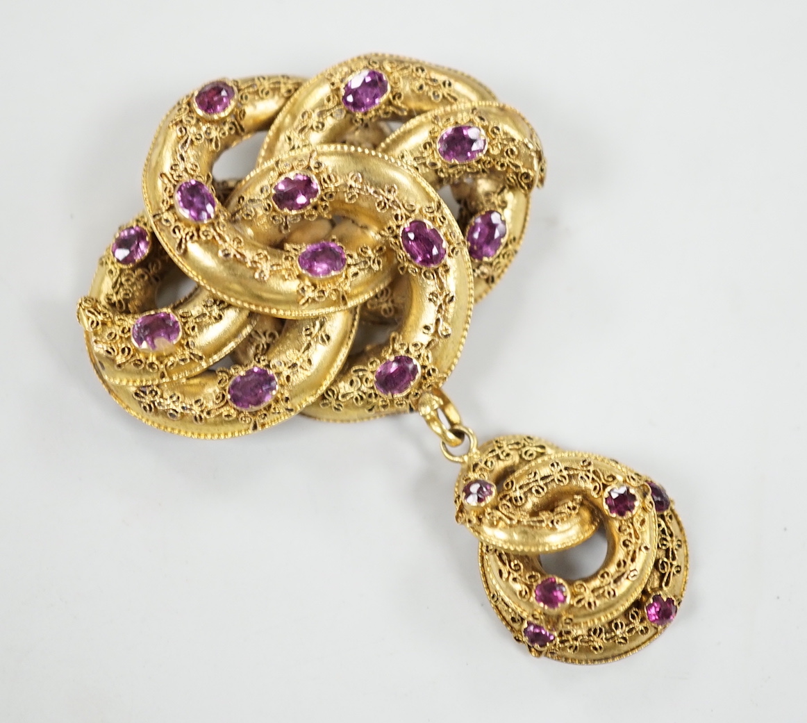 A Victorian yellow metal and amethyst paste? cluster set cannetile work scroll drop mourning brooch, overall 6cmm, gross weight 10.6 grams, pin a.f.